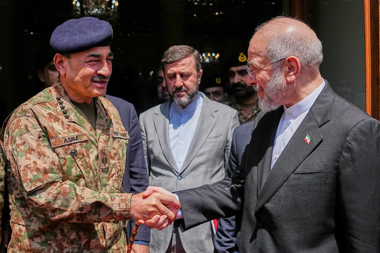 Iran's Parliamentary Speaker Mohammad Bagher Qalibaf, right, meets Pakistan's Army Chief Field Marshal Asim Munir in Tehran, Iran, Thursday, April 16, 2026. (Hamed Malekpour/ICANA via AP)