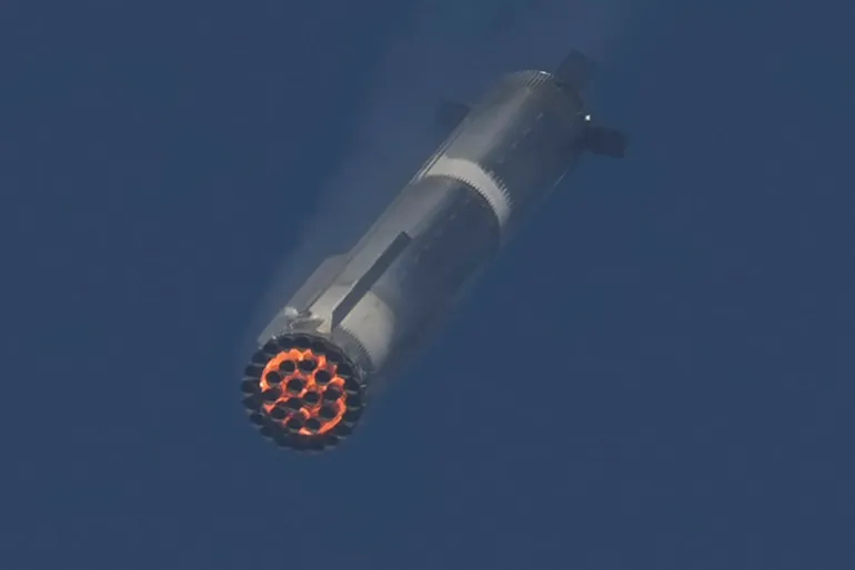The booster of SpaceX's mega rocket Starship is recaptured during a test flight from Starbase in Boca Chica, Texas, Thursday, March 6, 2025. (AP Photo/Eric Gay)