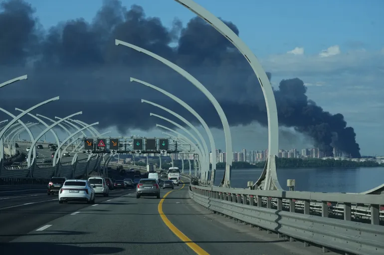 A plume of black smoke is seen over the port of St. Petersburg, Russia, Wednesday, June 3, 2026, after a Ukrainian drone attack. (AP Photo)