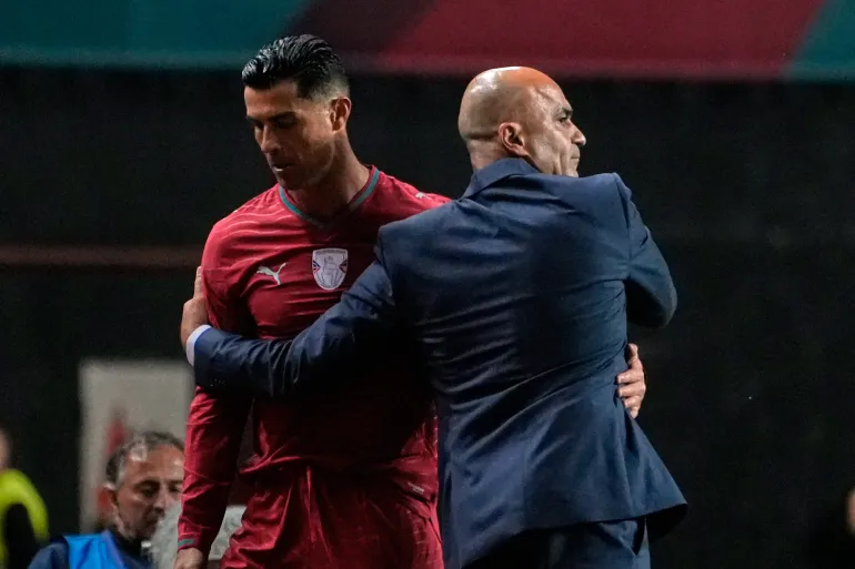 Portugal coach Roberto Martinez hugs Cristiano Ronaldo during an international friendly soccer match between Portugal and Nigeria in Leiria, Portugal, Wednesday, June 10, 2026. (AP Photo/Ana Brigida)
