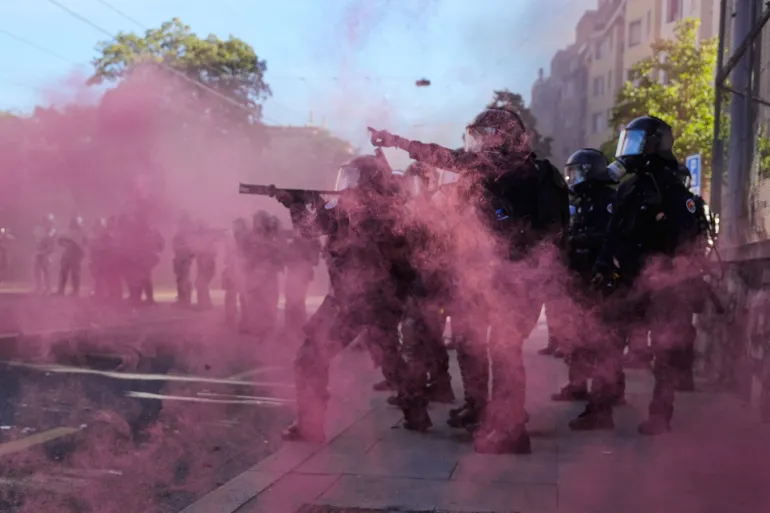 Police respond during a "No G7" demonstration in Geneva, Switzerland, Sunday, June 14, 2026, ahead of the G7 summit scheduled to take place June 15-17. (AP Photo/Baz Ratner)
