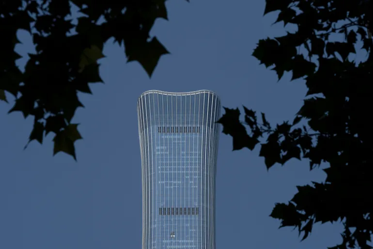 A damaged section is seen after a small plane crashed into the CITIC Tower, also known as China Zun, the tallest building in Beijing, on Saturday, June 27, 2026. (AP Photo/Ng Han Guan)