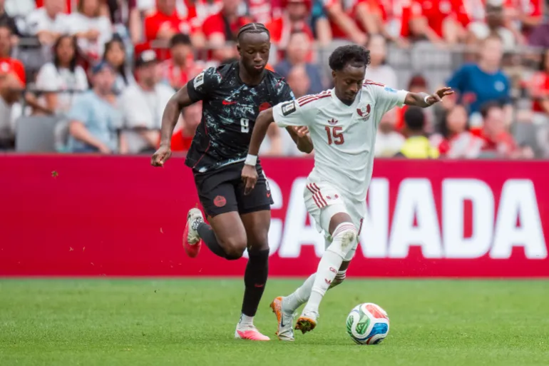 epa13048446 Canada midfielder Ismael Kone (L) pursues Qatar midfielder Yusuf Abdurisag (R) in the first half of the FIFA World Cup 2026 group stage match between Canada and Qatar in Vancouver, Canada, 18 June 2026. EPA/BOB FRID