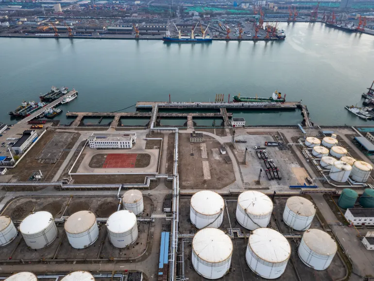 TIANJIN, CHINA - MARCH 30: Aerial view of oil storage tanks at a petrochemical production at Tianjin port on March 30, 2026 in Tianjin, China. Port of Tianjin operations and logistics is a large seaport on the Bohai Bay coast in northern China, The port forms a vital link in northern China's trade network. (Photo by Lintao Zhang/Getty Images)