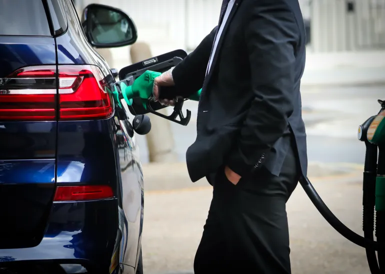 LONDON, ENGLAND - MAY 21: A person fills their car with fuel at a petrol station in Victoria on May 21, 2026 in London, United Kingdom. Fuel prices remain volatile as peace talks have stalled between the US and Iran in recent weeks. As a result, traffic through the Strait of Hormuz continues to be restricted, impacting the global supply chain of around one fifth of the world's petroleum. In the face of rising costs of fuel, the UK government has eased sanctions on Russian oil and liquefied natural gas (LNG) with a trade license that allows the import of Russian jet fuel and diesel refined in third countries, as well as the shipping of some LNG from Russia. (Photo by Alishia Abodunde/Getty Images)