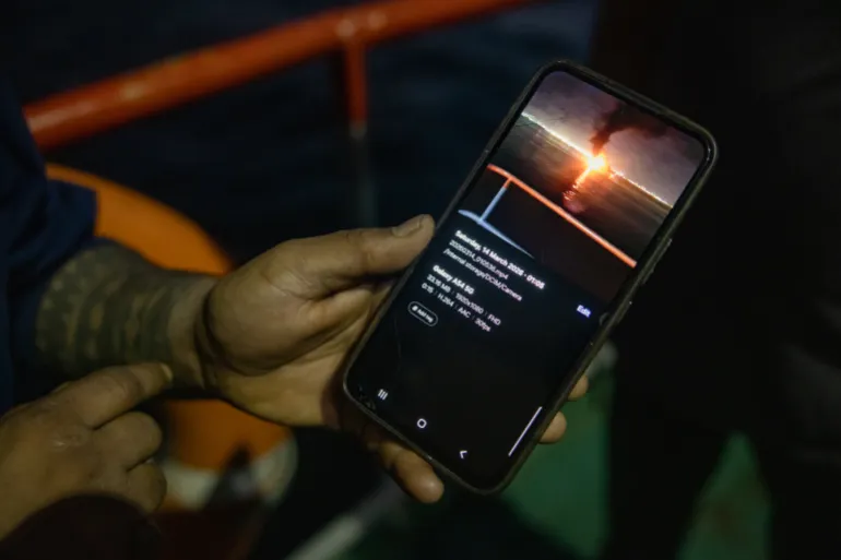 MUSCAT, OMAN - JUNE 23: An Indian sailor shows a picture on his mobile phone of an Iranian missile firing in the Strait of Hormuz on June 23, 2026 in Muscat, Oman. The Strait of Hormuz, a vital shipping route for the region's oil and gas, was effectively blockaded since the outbreak of war between the United States and Iran in late February. This week's provisional peace deal between the countries was meant to reopen the waterway to shipping traffic, but the pace of that reopening is unclear amid continued fighting in Lebanon and the need to clear the Strait of sea mines. On Sunday, U.S. Vice President JD Vance arrived in Switzerland for high-level talks with the Iranian delegation, as the two sides seek to clarify the terms of ending the war. (Photo by Elke Scholiers/Getty Images)