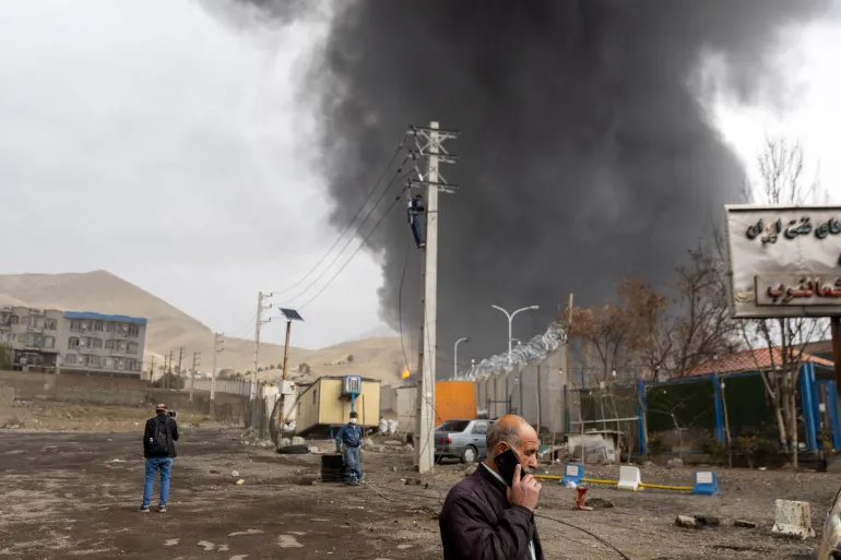 TEHRAN, IRAN - MARCH 8: Smoke billows after overnight airstrikes on oil depots on March 8, 2026 in Tehran, Iran. The United States and Israel continued their joint attack on Iran that began on February 28. Iran retaliated by firing waves of missiles and drones at Israel, and targeting U.S. allies in the region. (Photo by Majid Saeedi/Getty Images)