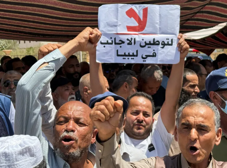 Protesters gather outside the headquarters of the United Nations High Commissioner for Refugees (UNHCR), demanding the organisation leave the country and calling for an end to migrant settlement and the deportation of migrants and refugees, in Tripoli, Libya, June 4, 2026. Picture taken with a mobile phone. REUTERS/Ayman al-Sahili