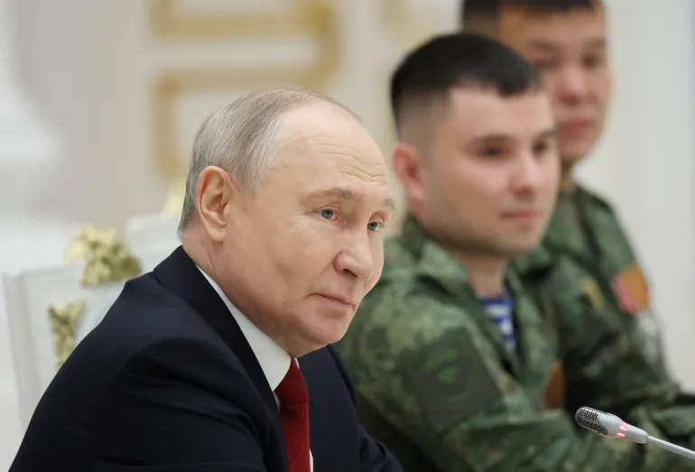 Russia's President Vladimir Putin attends a meeting with service members of the Russian armed forces involved in the country's military campaign in Ukraine, following an award ceremony marking Russia Day national holiday at the Kremlin in Moscow, Russia, June 12, 2026. Sputnik/Alexander Kazakov/Pool via REUTERS ATTENTION EDITORS - THIS IMAGE WAS PROVIDED BY A THIRD PARTY.