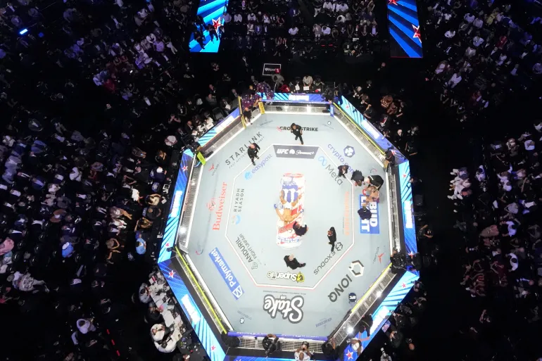 Alex Pereira is attended to as Ciryl Gane lies in the center of the ring during UFC Freedom 250 on the South Lawn of the White House, Monday, June 15, 2026, in Washington. Alex Brandon/Pool via REUTERS