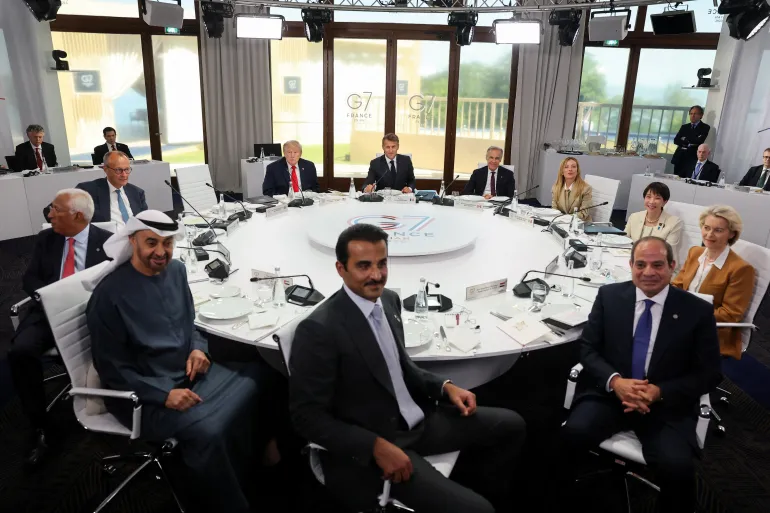 Japan's Prime Minister Sanae Takaichi, Germany's Chancellor Friedrich Merz, Italy's Prime Minister Giorgia Meloni, U.S. President Donald Trump, European Commission President Ursula von der Leyen, Canadian Prime Minister Mark Carney, Britain's Prime Minister Keir Starmer, European Council President Antonio Costa, French President Emmanuel Macron, Emir of Qatar, Sheikh Tamim bin Hamad Al Thani, President of the United Arab Emirates (UAE) Sheikh Mohamed bin Zayed Al Nahyan and Egyptian President Abdel Fattah al-Sisi, attend a working lunch during the G7 summit, in Evian-les-Bains, France, June 16, 2026. REUTERS/Christian Hartmann/Pool