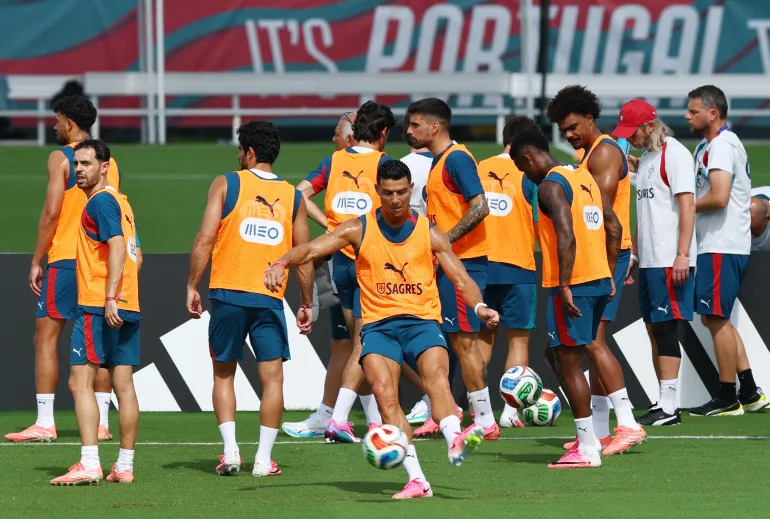 Soccer Football - FIFA World Cup 2026 - Portugal Training - Gardens North County District Park, Palm Beach Gardens, Florida, U.S. - June 19, 2026 Portugal's Cristiano Ronaldo and Bernardo Silva with teammates during training REUTERS/Marco Bello