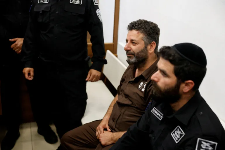 Activist Saif Abu Keshek, a member of the Global Sumud Flotilla detained by Israel, sits at a magistrate's court for a detention extension hearing in Ashkelon, southern Israel, May 3, 2026. REUTERS/Amir Cohen TPX IMAGES OF THE DAY