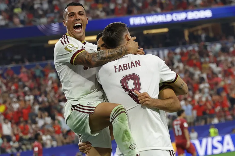 epa13093078 Mikel Merino (R) of Spain celebrates with Fabian Ruiz (C) and Pedro Porro (up) after scoring the 1-0 lead during the FIFA World Cup 2026 Round of 16 match Portugal against Spain, in Dallas, USA, 06 July 2026. EPA/CHRISTOPHER NEUNDORF
