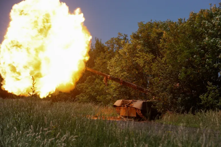 Ukrainian servicemen of the 30th Kostiantyn Ostrozkyi Separate Mechanized Brigade fire from a T-80 main battle tank captured earlier from Russian troops, in a field near the front line town of Bakhmut, amid Russia's attack on Ukraine, in Donetsk region, Ukraine June 19, 2023. Radio Free Europe/Radio Liberty/Serhii Nuzhnenko via REUTERS